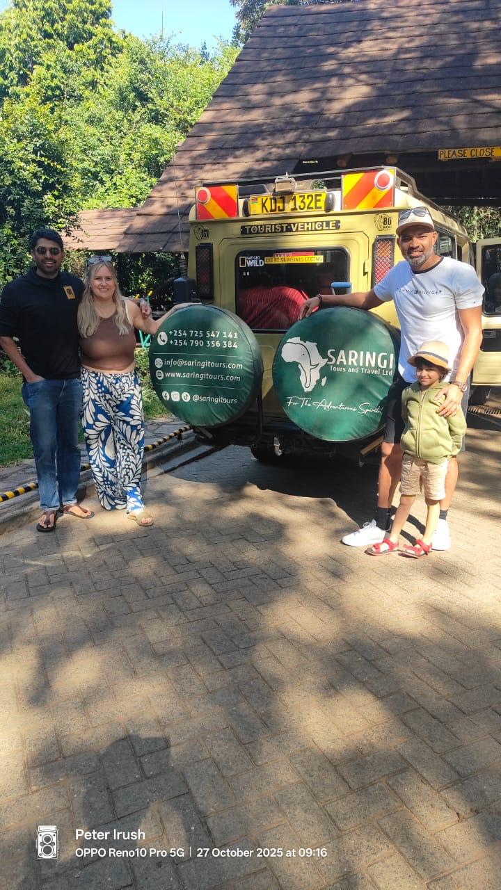 Saringi clients at Sarova Lodge with safari vehicle
