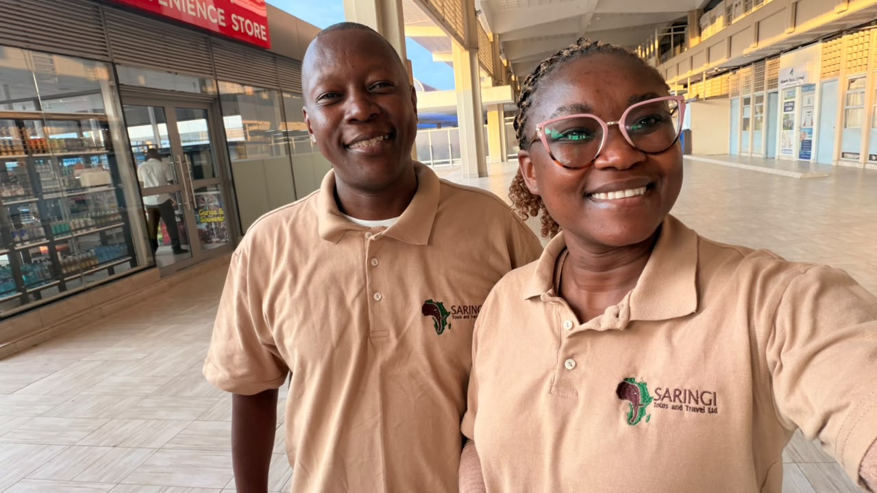 Saringi Tours team members in uniform at the airport